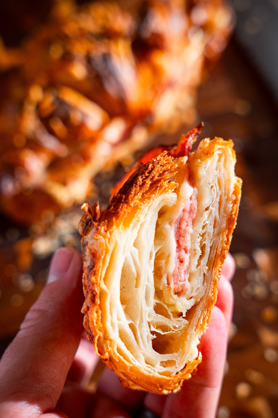 A close-up of the crisp layers inside a freshly baked pastry