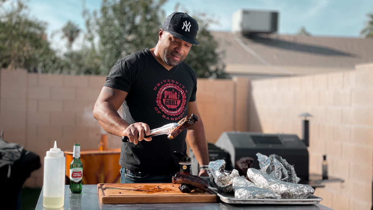 A chef preparing a meal on an outdoor grill